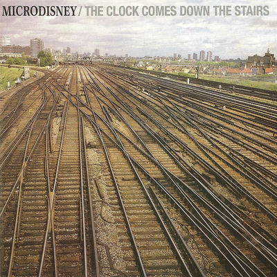 The cover of The Clock Comes Down the Stairs by Microdisney